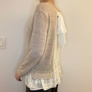 Lace back beige sweater with long sleeves and ruffle hem